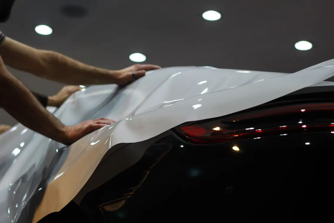 Smoothing film over a car body photograph
